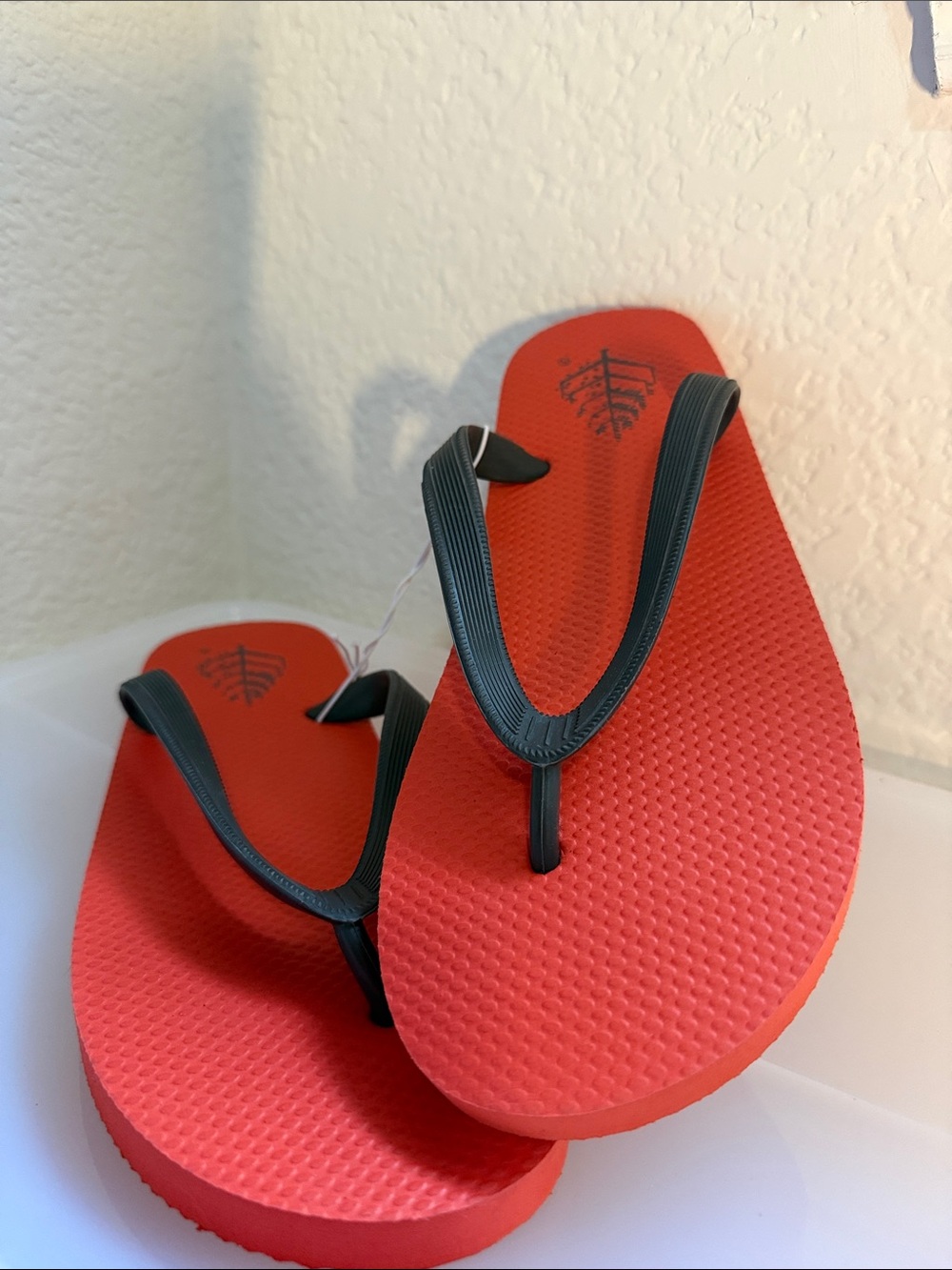 Four Seasons Resort Orange Logo Flip Flop Sandals with Black Straps